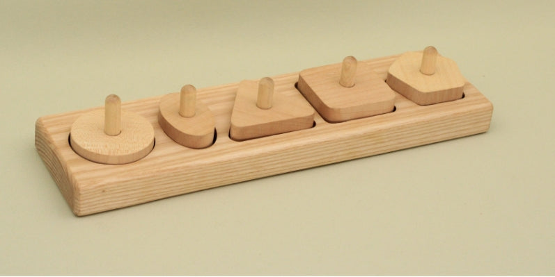 A wooden toy featuring four colorful pieces neatly arranged in a holder, designed for imaginative play and learning.
